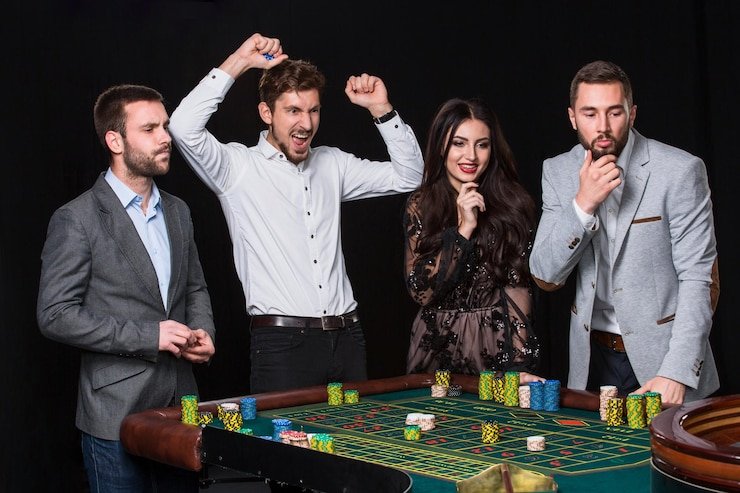 Live No Commission Baccarat dealer table with card hands displayed